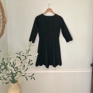 Lulus semi formal black long sleeve skater dress,scalloped sleeve/hem Size med